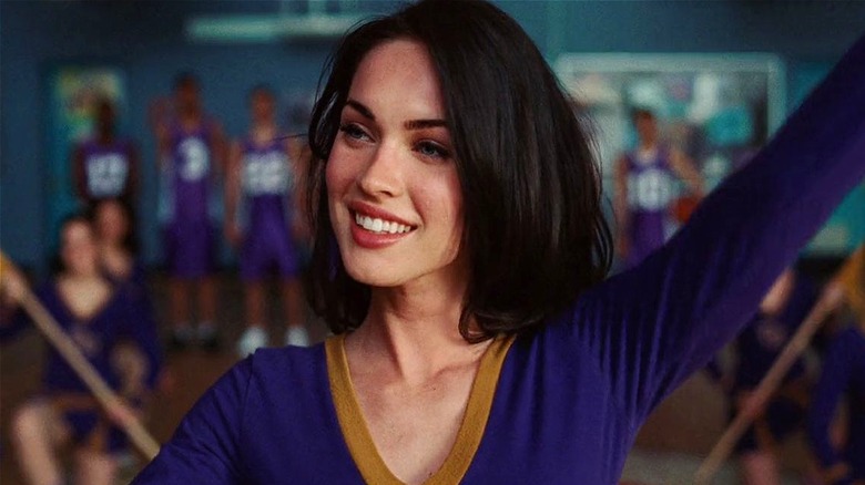 Jennifer Check smiling and performing at school