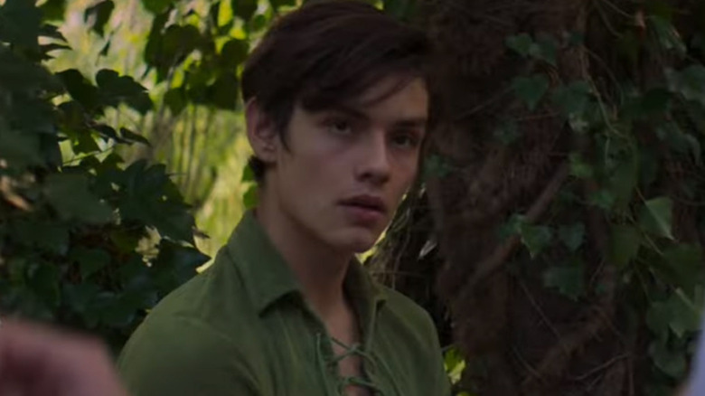 Louis Partridge as Peter Pan