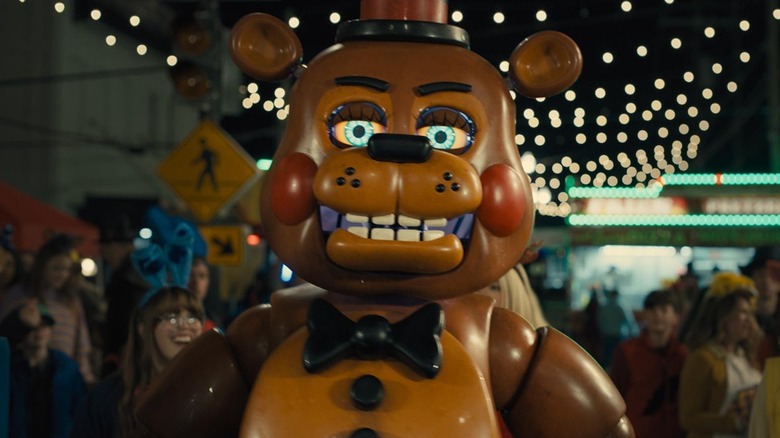 Freddy Fazbear walking amongst his fans in Five Nights at Freddy's 2 (2025)