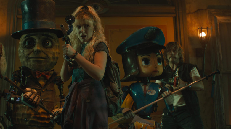 Michelle Greene leading her robot pals in "The Electric State" (2025).