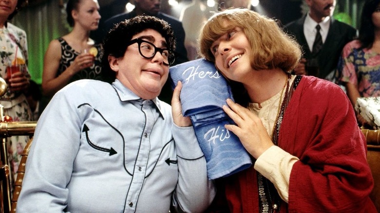 Pat and Chris hold towels to their ears in 'It's Pat!' (1994)