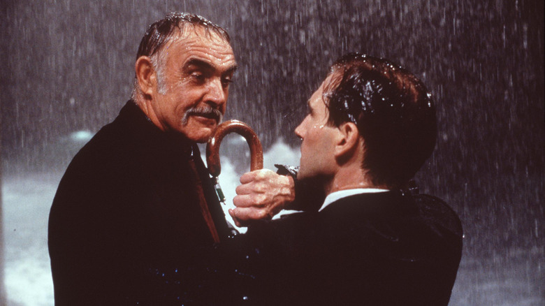 Sir August de Wynter fights John Steed in the rain in 'The Avengers' (1998)