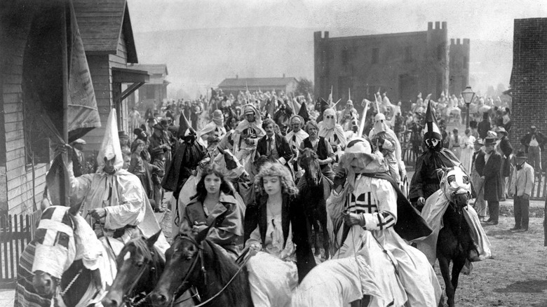 The Klan leading citizens through town in The Birth of a Nation (1915)