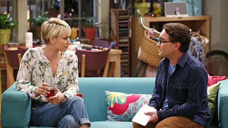 Penny and Leonard talking on the couch on The Big Bang Theory