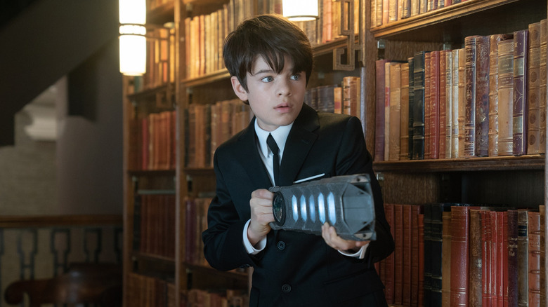 Artemis Fowl II aims a weapon in "Artemis Fowl"