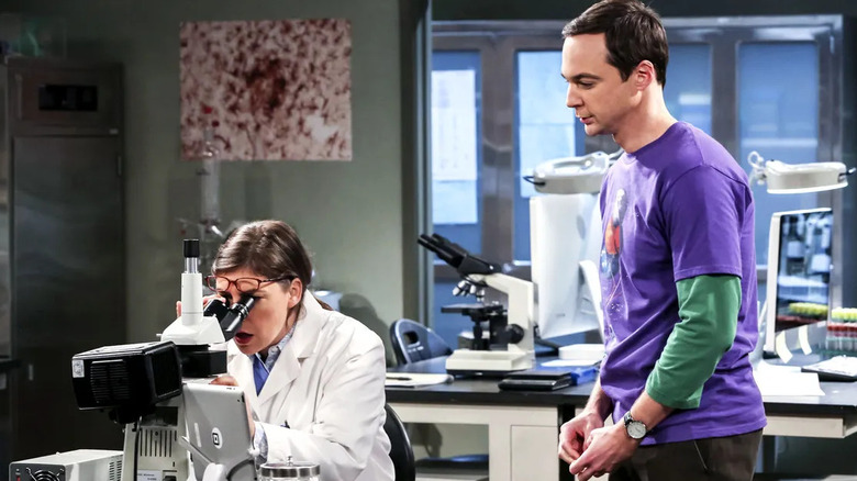 Amy looking into a microscope in her lab on The Big Bang Theory