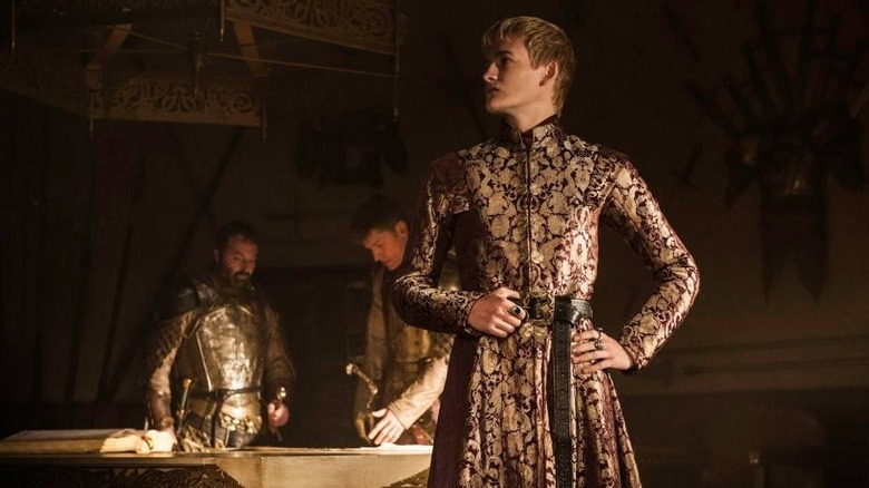 Joffrey standing in his chambers posing on Game of Thrones