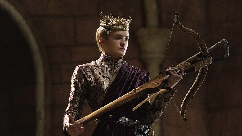 Joffrey holding a crossbow wearing a crown in Game of Thrones