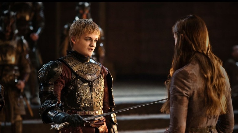 Joffrey talking to Sansa in the throne room of Game of Thrones