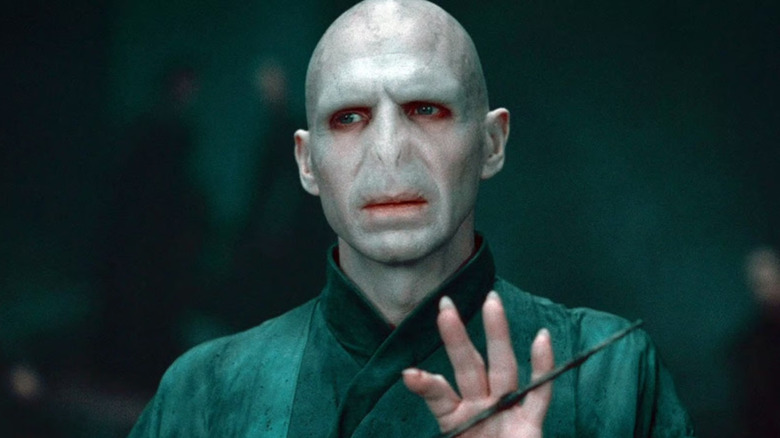 Voldemort caressing his wand in Harry Potter and the Deathly Hallows Part 2