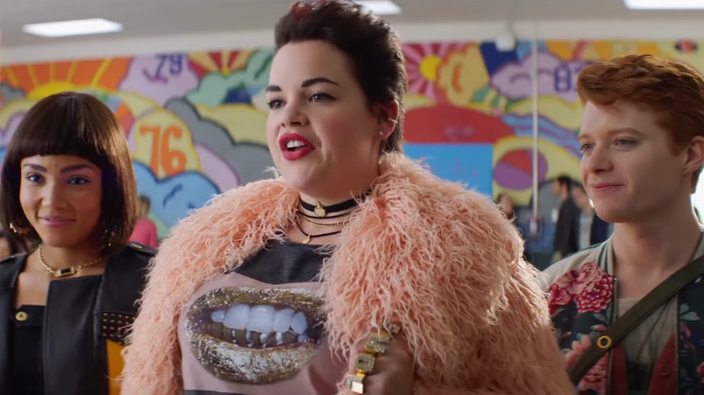 Heather McNamara, Heather Chandler, and Heather Duke standing together in Heathers