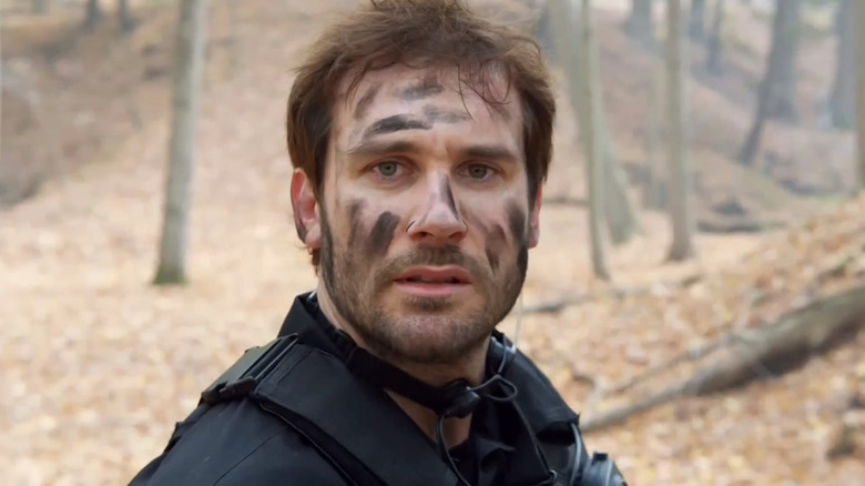 Bryan Mills wearing black face paint in Taken