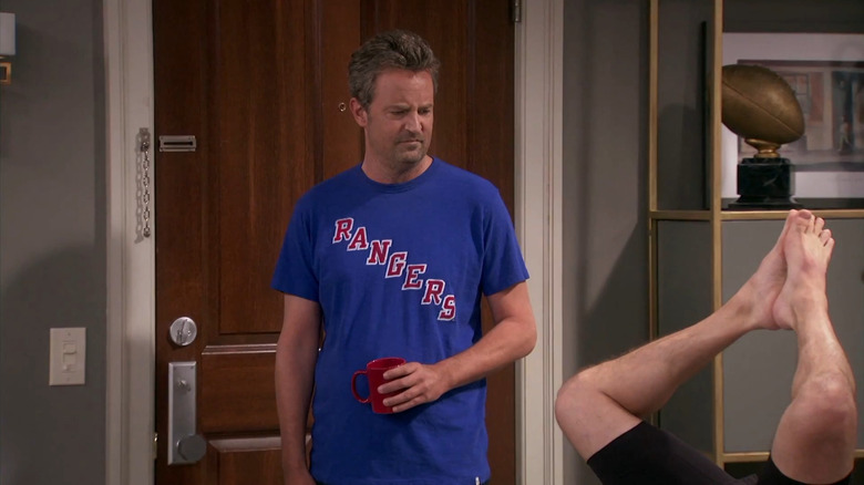 Oscar Madison looking at Felix Unger's legs in The Odd Couple