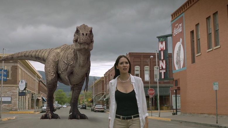 A random woman being stalked by a dinosaur in Dinosaurs vs. Aliens (2015)