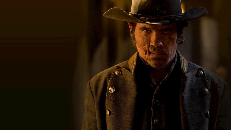 Jonah Hex scowling when a door is opened in Jonah Hex (2010)