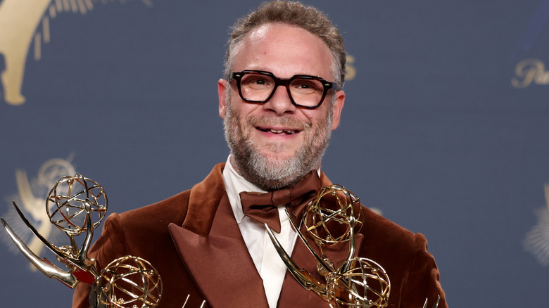 Seth Rogen holding his Emmys in 2025