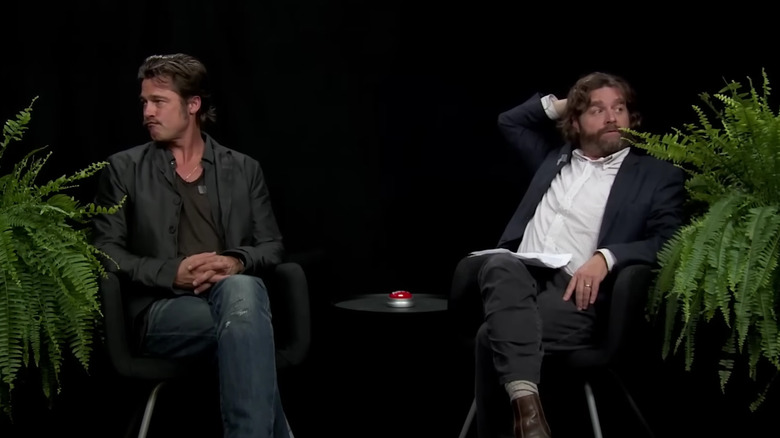 Brad Pitt and Zach Galifianakis sitting between two ferns on Between Two Ferns with Zach Galifianakis