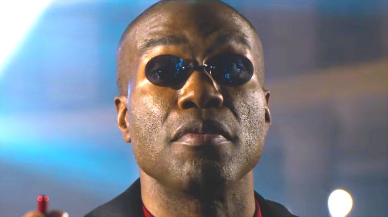 Morpheus holding red pill