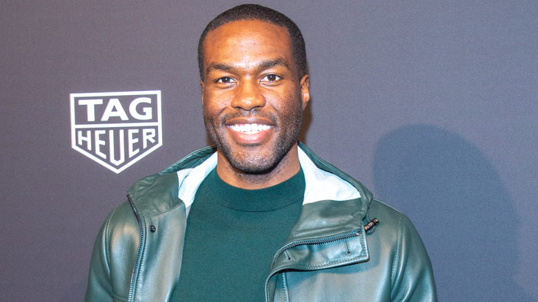 Yahya Abdul-Mateen II wearing green