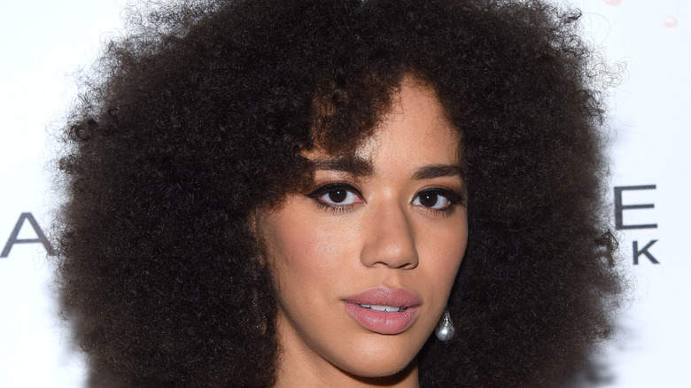 Jasmin Savoy Brown poses on the red carpet