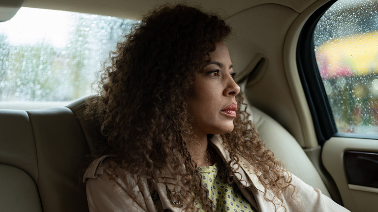 Tawny Cypress Taissa looking out car window