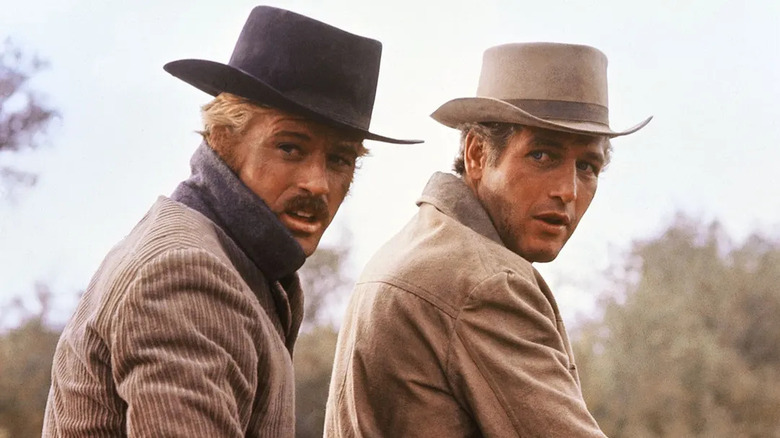 Butch Cassidy and the Sundance Kid looking concerned on horseback