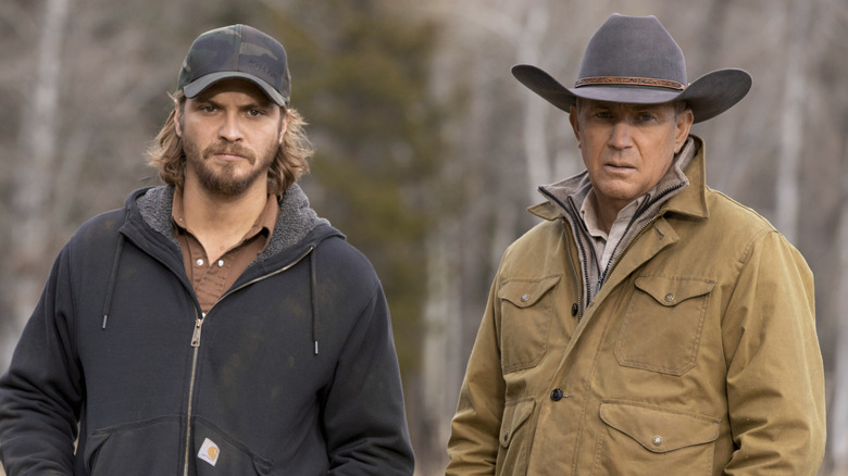 Kayce and John look on