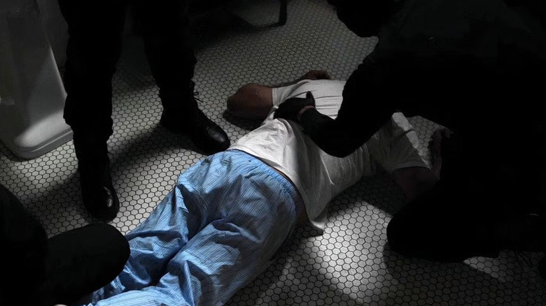 "John Dutton" lies dead on the bathroom floor in "Yellowstone"
