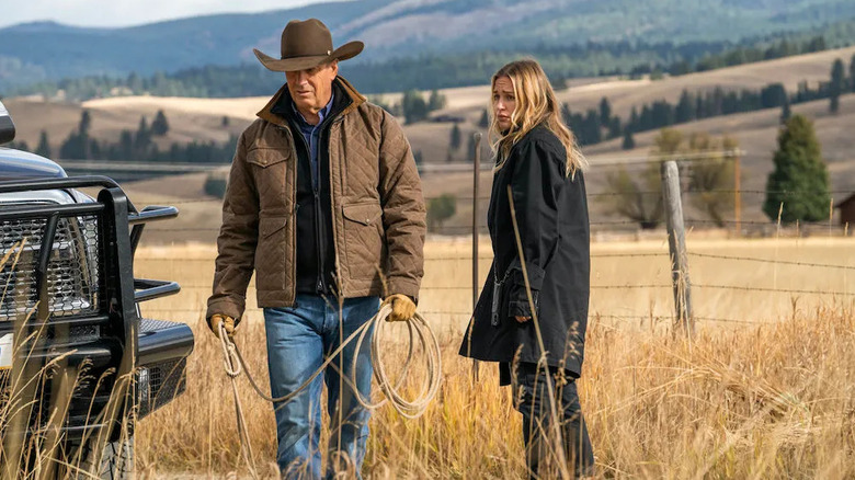 Summer Higgins stares at John Dutton as they both stand in a paddock in "Yellowstone"
