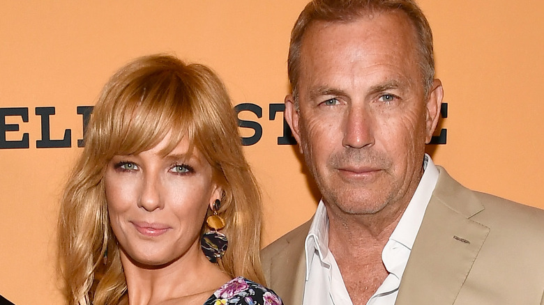Kelly Reilly and Kevin Costner posing