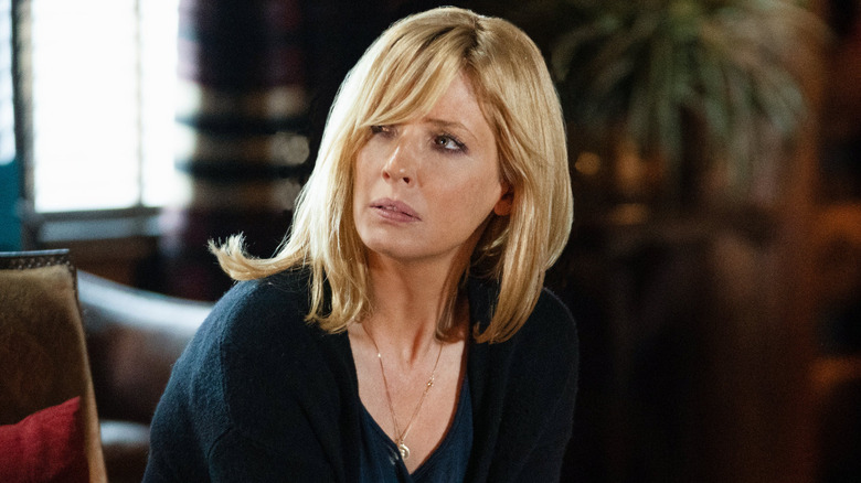 Beth Dutton looks across the room