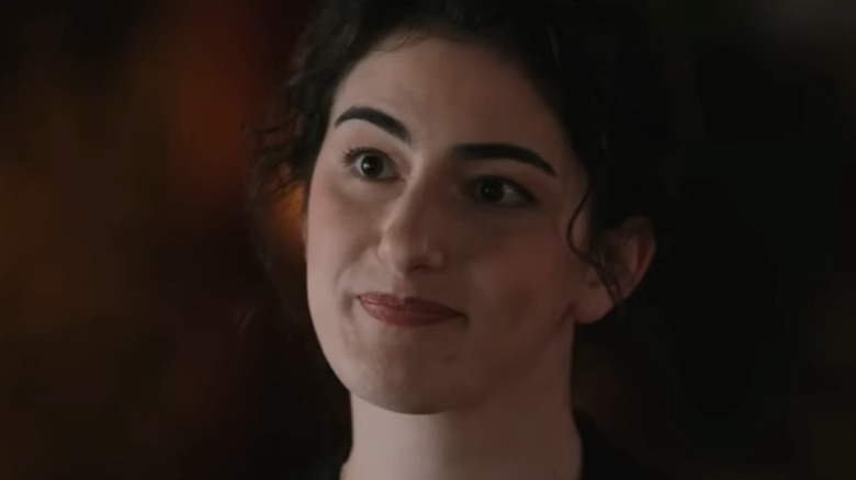 Clara Smiling curtly