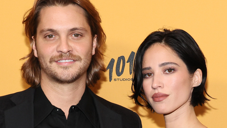 Luke Grimes and Kelsey Asbille posing at event