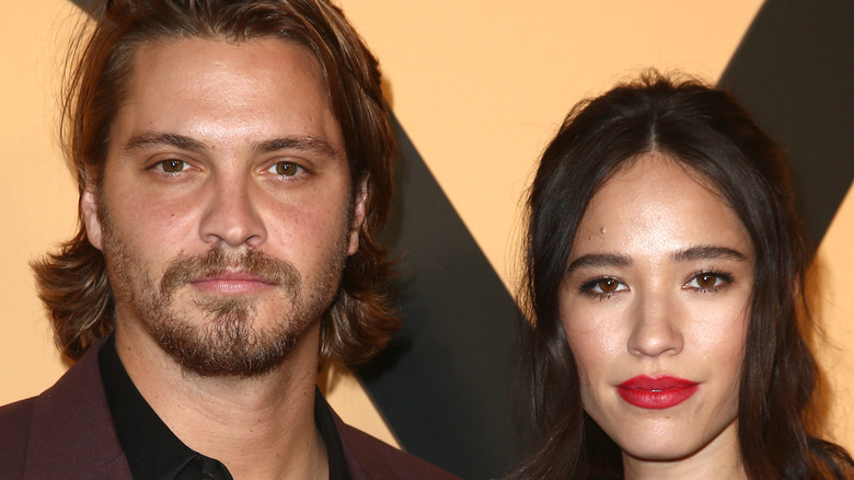 Luke Grimes and Kelsey Asbille posing