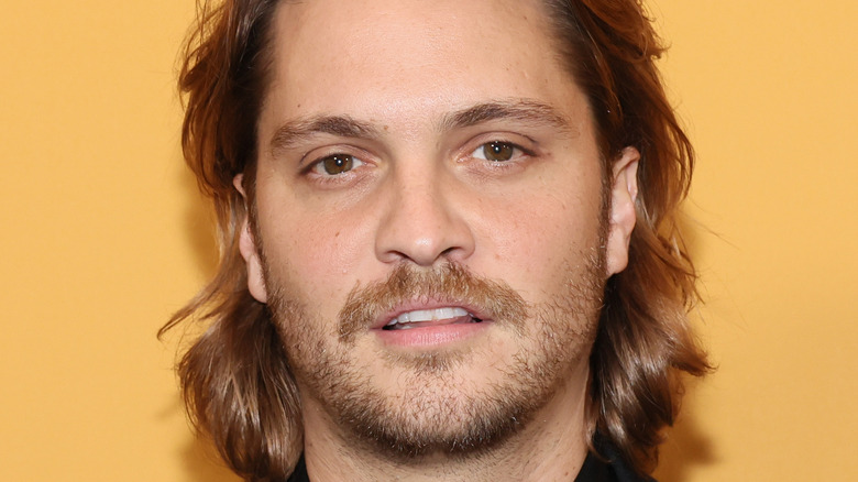 Luke Grimes posing for press