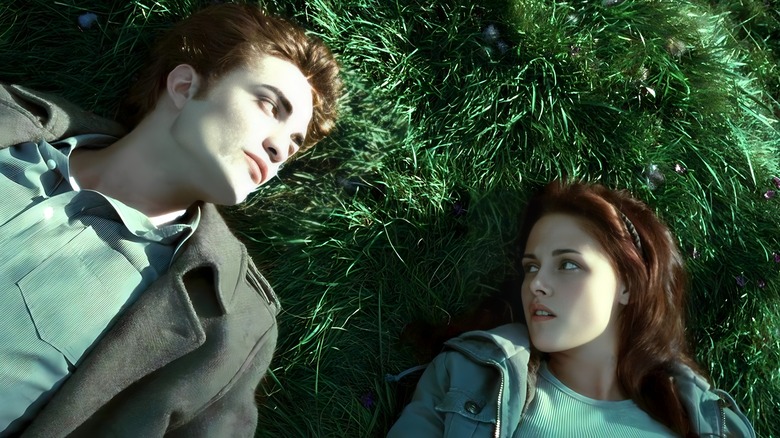 Bella laying in grass with Edward