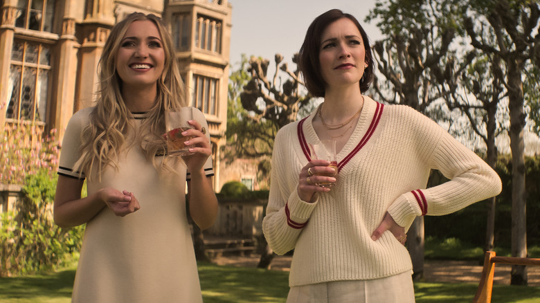Lady Phoebe and Kate hold drinks