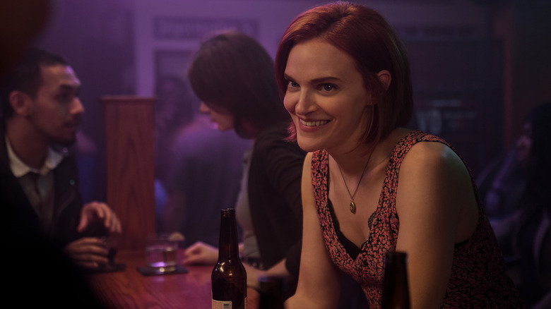 Bronte smiling in a bar