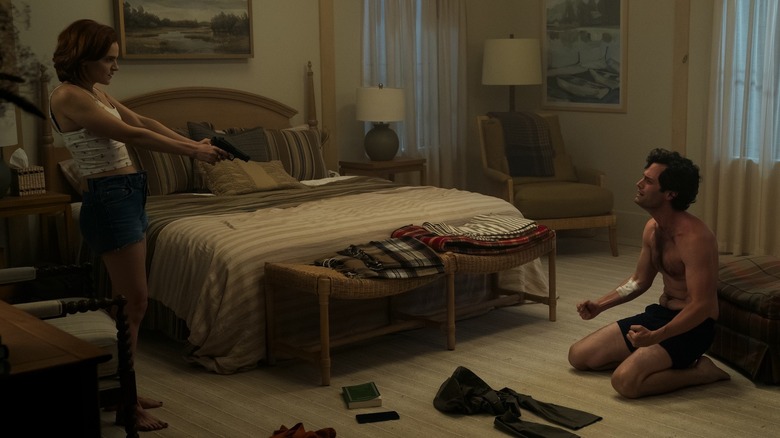 Bronte holding a gun on Joe
