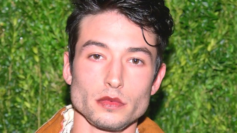 Ezra Miller green leafy background