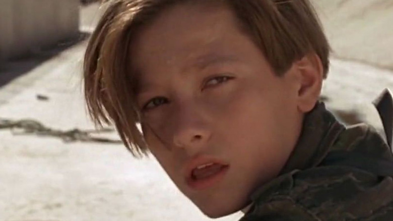 Young John Connor looking behind himself