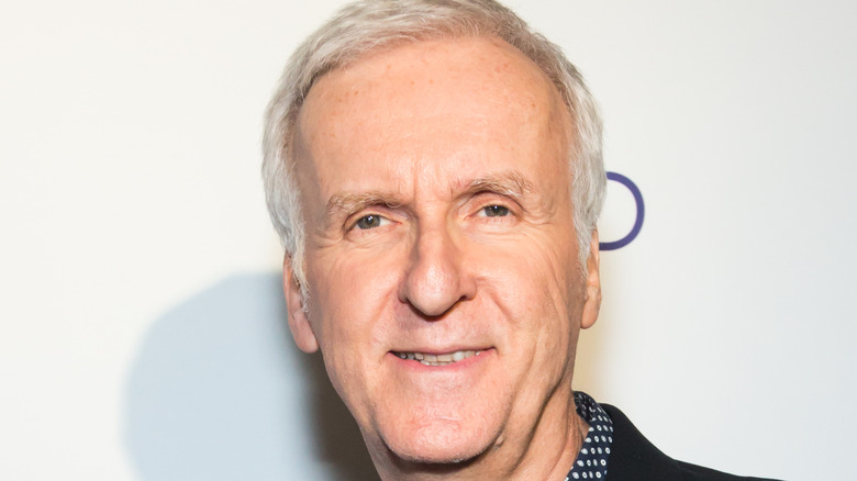 James Cameron smiling into camera