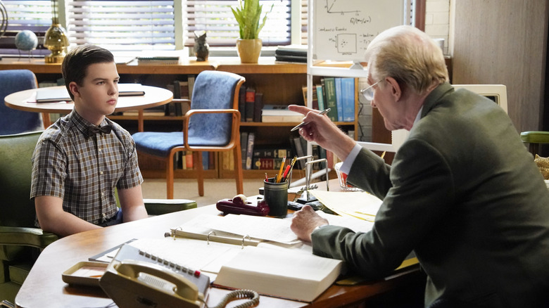 Dr. Linkletter pointing at Sheldon
