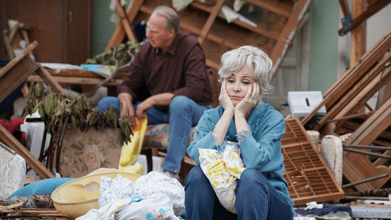 Meemaw and Dale picking through the ruins of her house in "Young Sheldon"