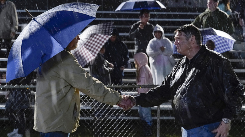 George Sr. shaking hands with Tom Peterson in "Young Sheldon"