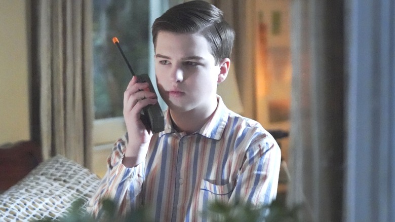Sheldon holding walkie-talkie