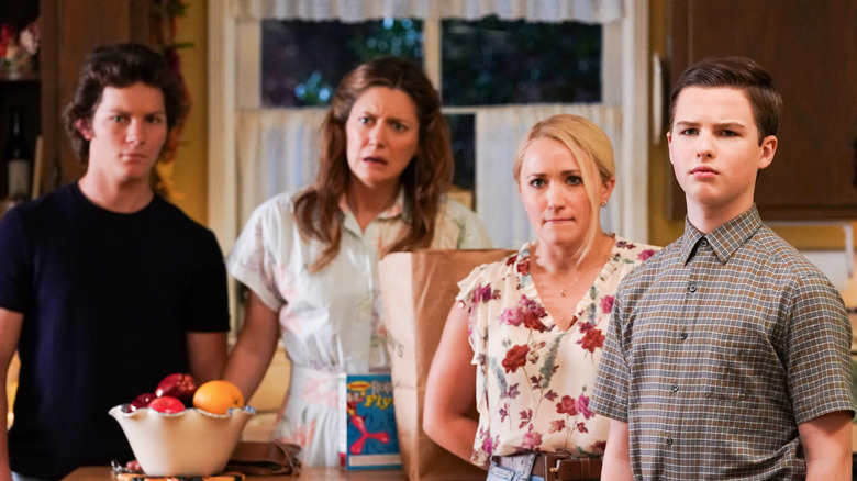 Cooper family looking surprised in kitchen