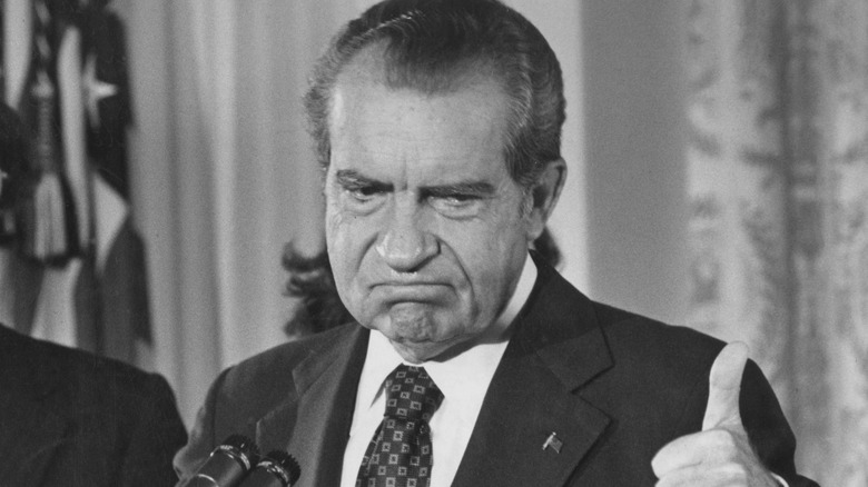 Richard Nixon giving a thumbs up
