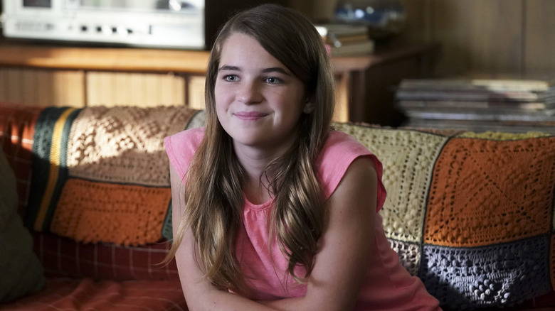 Missy Cooper sitting on the couch on Young Sheldon