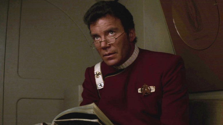 Captain Kirk reading while wearing glasses in "The Wrath of Khan"